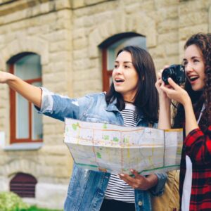 Person planning international travel itinerary on world map for visa and holiday trip